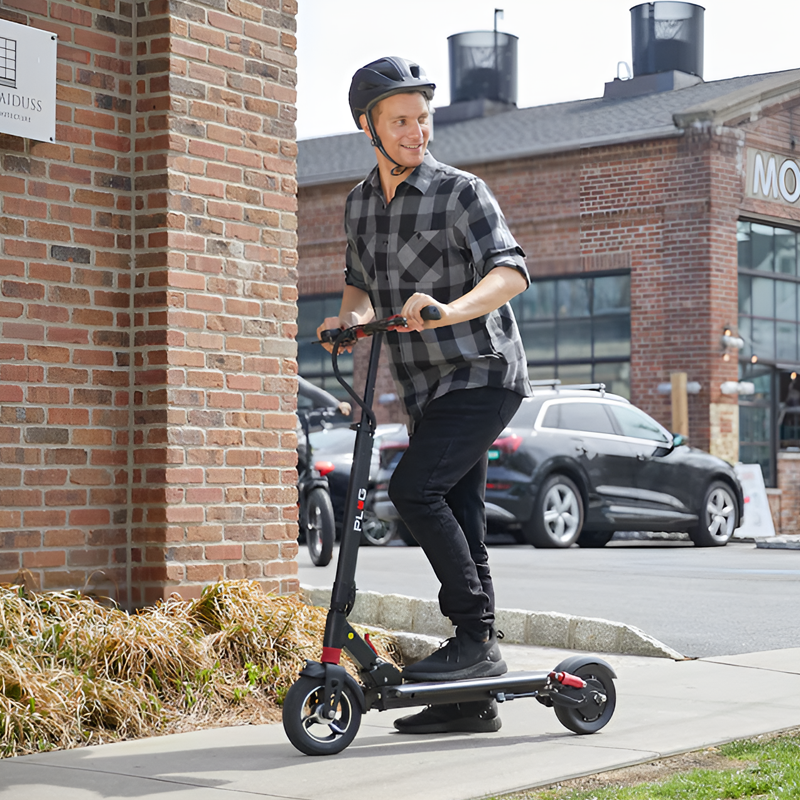 Commuter riding ZERO 8 scooter through city bike lane